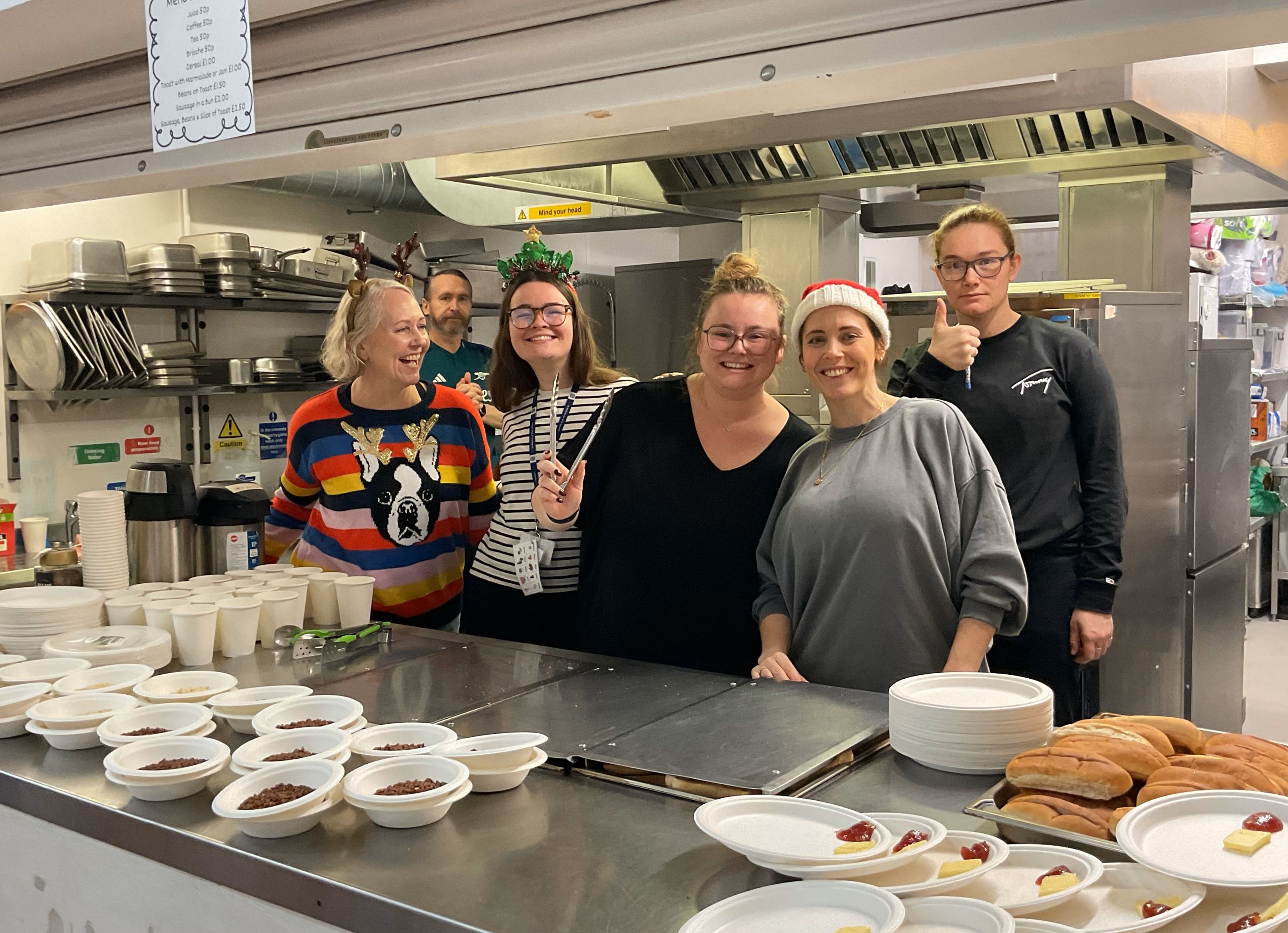 SWOY staff at Advent Breakfast 2024 Photo of staff serving festive food
